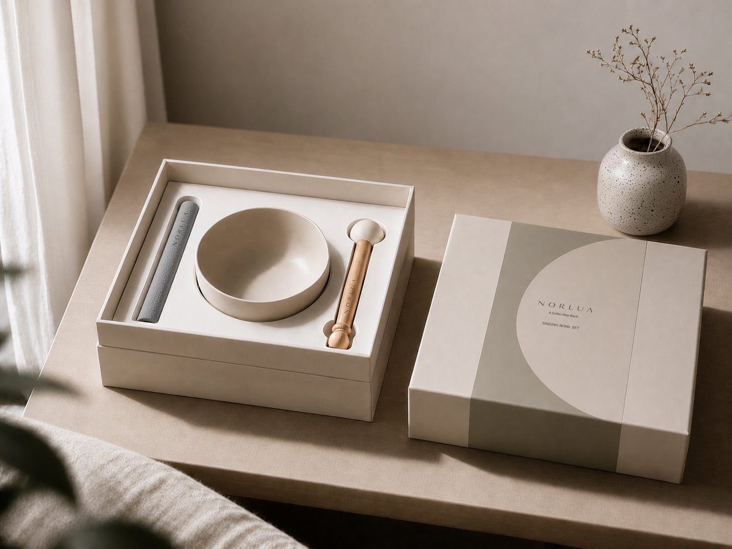 NORLUA singing bowl gift set displayed with its presentation box in soft natural light