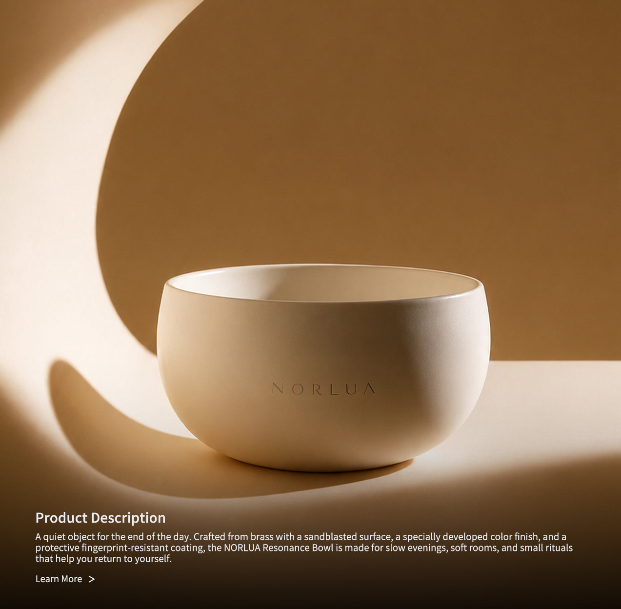 NORLUA brass singing bowl displayed in warm sculptural light with product description text