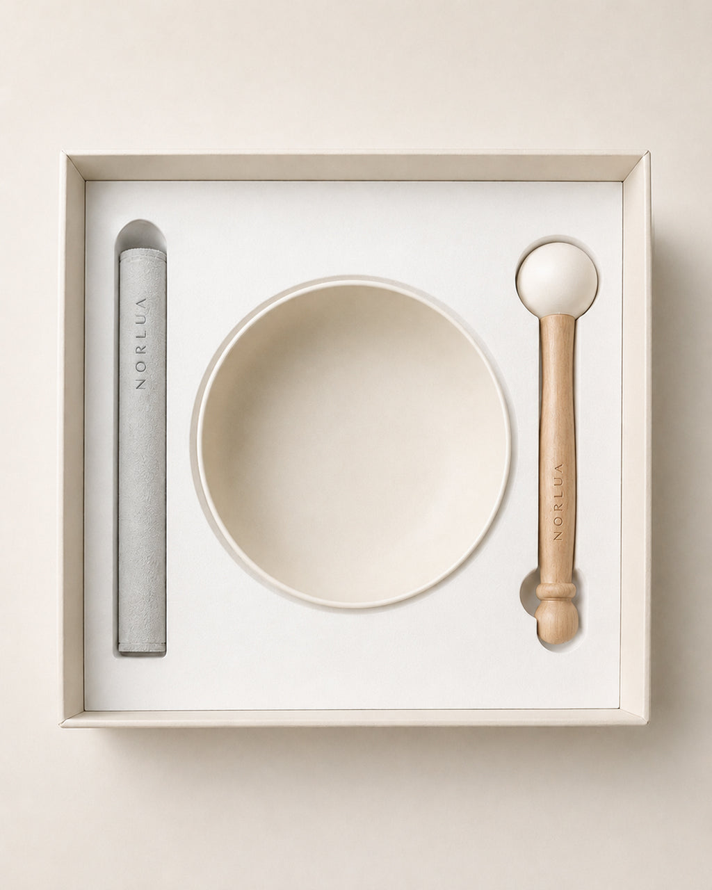 Top view of the NORLUA singing bowl set arranged inside its protective gift packaging