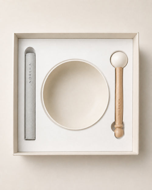 Top view of the NORLUA singing bowl set arranged inside its protective gift packaging